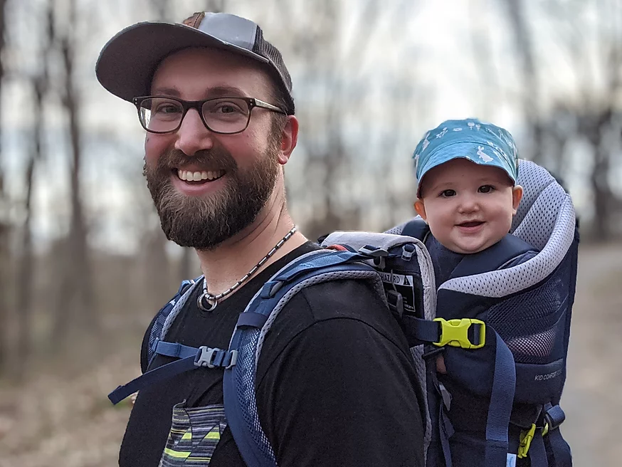 Noah Wilson hiking with baby