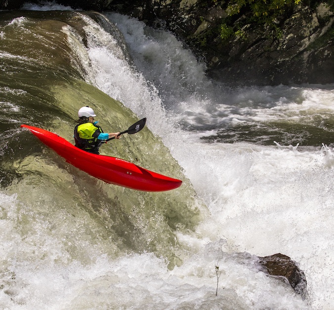 Anna Levesque paddling over a waterfall on the Cheoah River