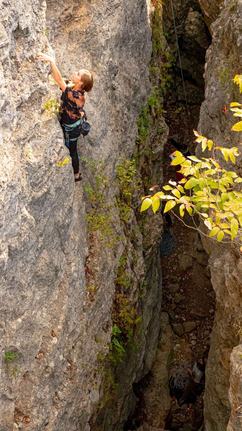 A woman is rock climbing